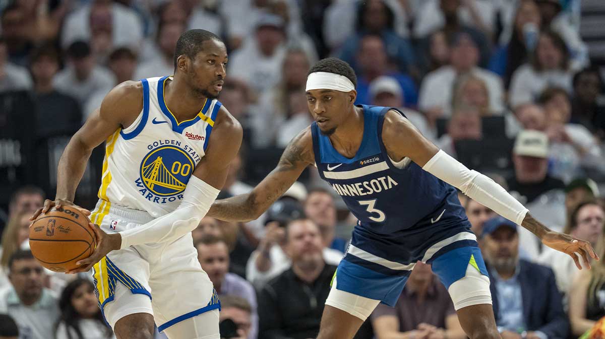 Golden State Warriors forward Jonathan Kuminga (00) looks to pass the ball as Minnesota Timberwolves forward Jaden McDaniels (3) plays defense in the first half during game five of the second round for the 2025 NBA Playoffs at Target Center.