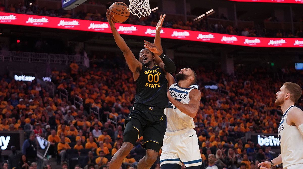 Golden State Warriors forward Jonathan Kuminga (00) makes a layup in front of Minnesota Timberwolves center Rudy Gobert (27) in the third quarter during game four of the second round for the 2025 NBA Playoffs at Chase Center