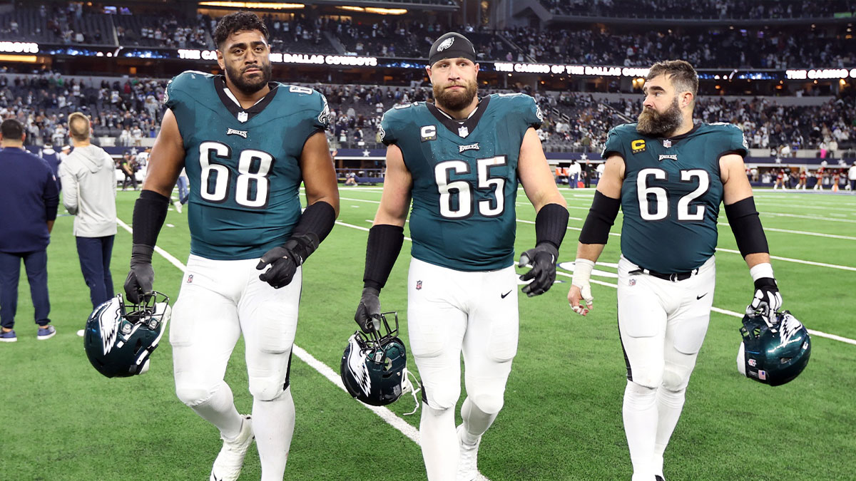 Philadelphia Eagles offensive tackle Jordan Mailata (68) and offensive tackle Lane Johnson (65) and center Jason Kelce (62) walk off the field after the game against the Dallas Cowboys at AT&T Stadium.