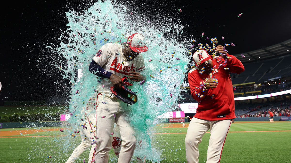 Los Angeles Angels right fielder Jorge Soler (12, left) has liquid dunked on him after hitting a walk-off double during the ninth inning against the Toronto Blue Jays at Angel Stadium
