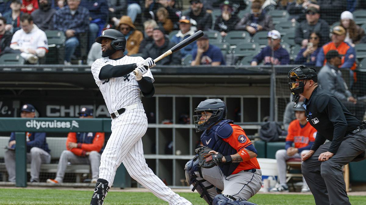 Chicago White Sox center fielder Luis Robert Jr. (88) singles against the Houston Astros during the first inning at Rate Field.