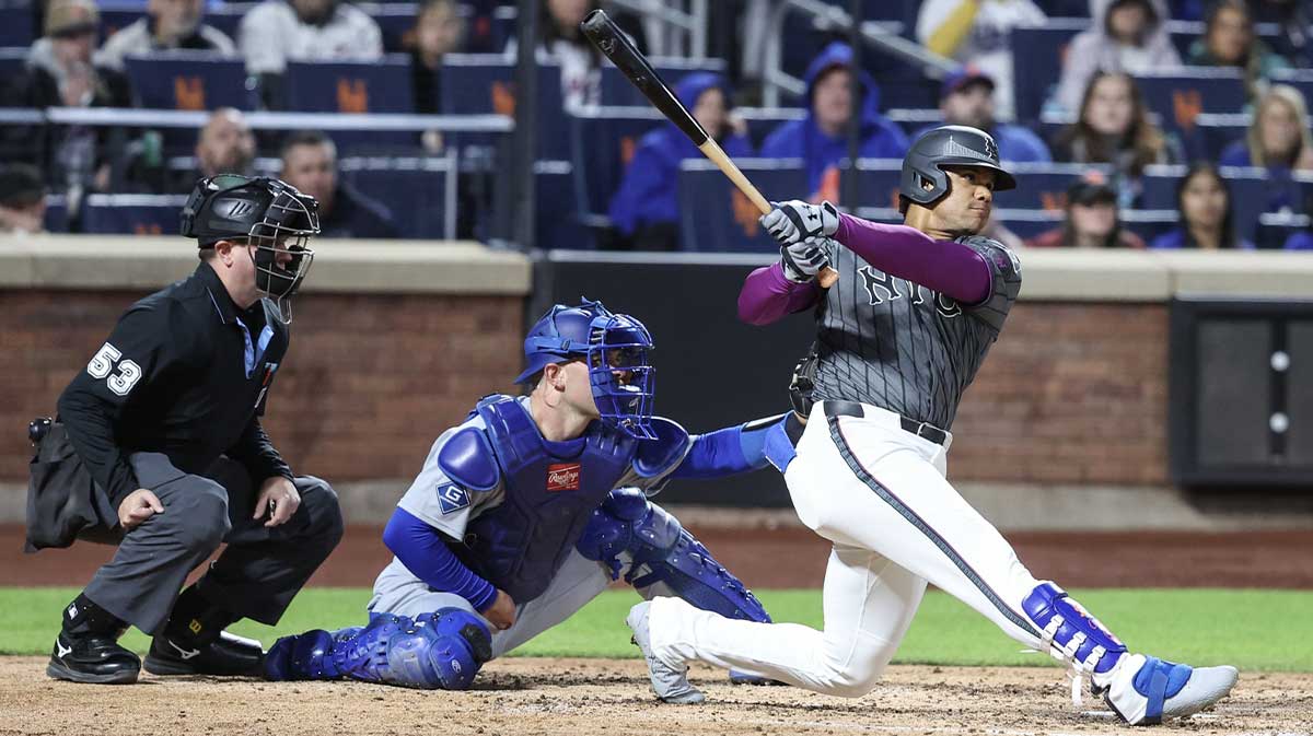 May 24, 2025; New York City, New York, USA; New York Mets right fielder Juan Soto (22) hits a two run double in the fourth inning against the Los Angeles Dodgers at Citi Field.