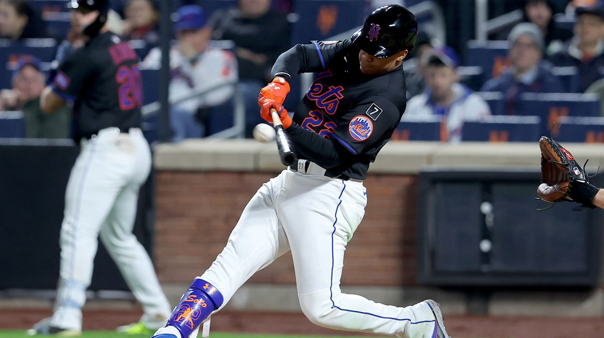 New York Mets right fielder Juan Soto (22) hits a solo home run against the Chicago Cubs during the fourth inning at Citi Field.