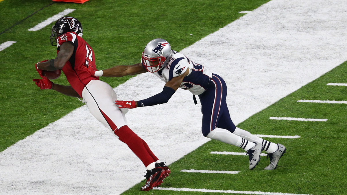 Atlanta Falcons wide receiver Julio Jones (11) makes a first quarter catch with New England Patriots cornerback Eric Rowe (25) defending during Super Bowl LI at NRG Stadium.