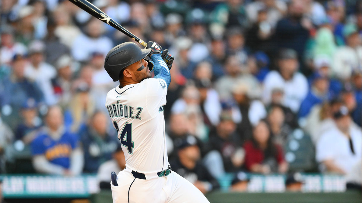 May 12, 2025; Seattle, Washington, USA; Seattle Mariners center fielder Julio Rodriguez (44) hits a home run against the New York Yankees during the first inning at T-Mobile Park.