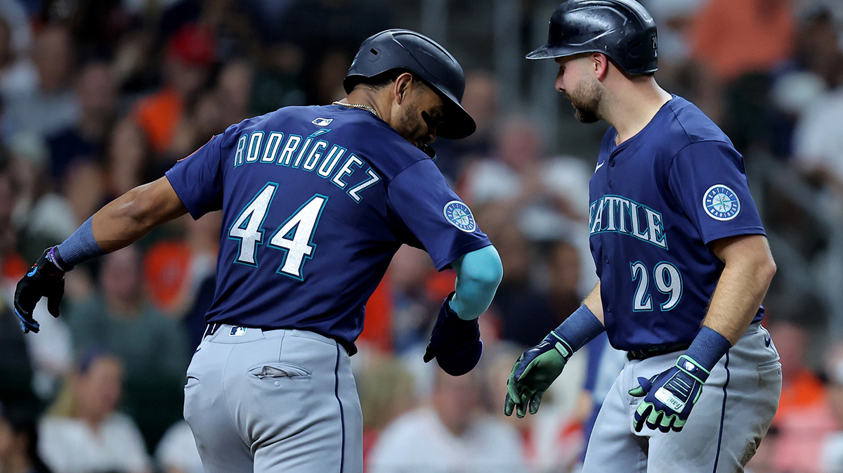 Seattle Mariners catcher Cal Raleigh (29) is congratulated by Seattle Mariners center fielder Julio Rodríguez (44) after hitting a two-run home run against the Houston Astros during the seventh inning at Daikin Park.