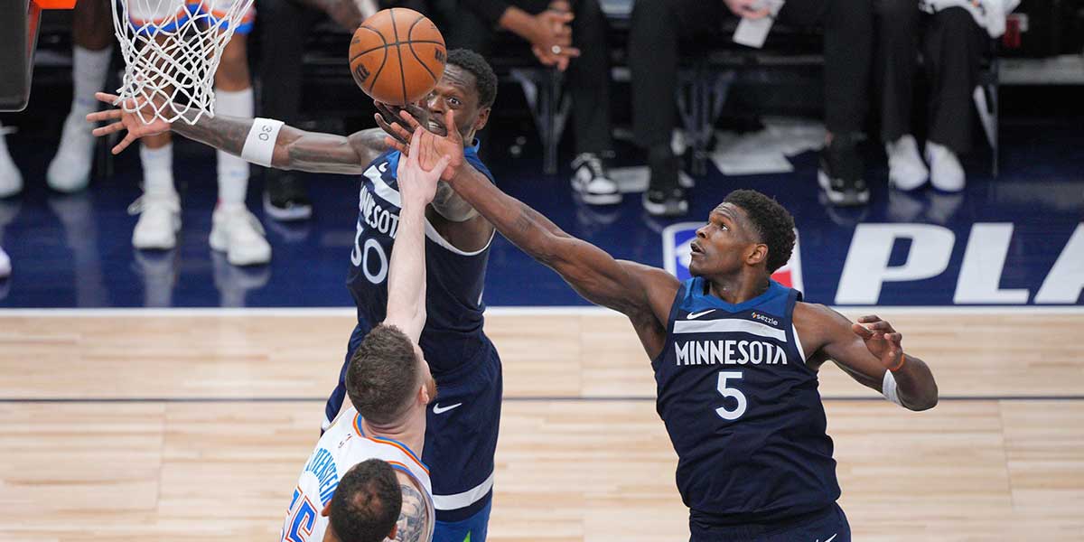 Minnesota Timberwolves forward Julius Randle (30),guard Anthony Edwards (5) and Oklahoma City Thunder center Isaiah Hartenstein (55) attempt to get a rebound during the second half in game three of the western conference finals for the 2025 NBA Playoffs at Target Center.
