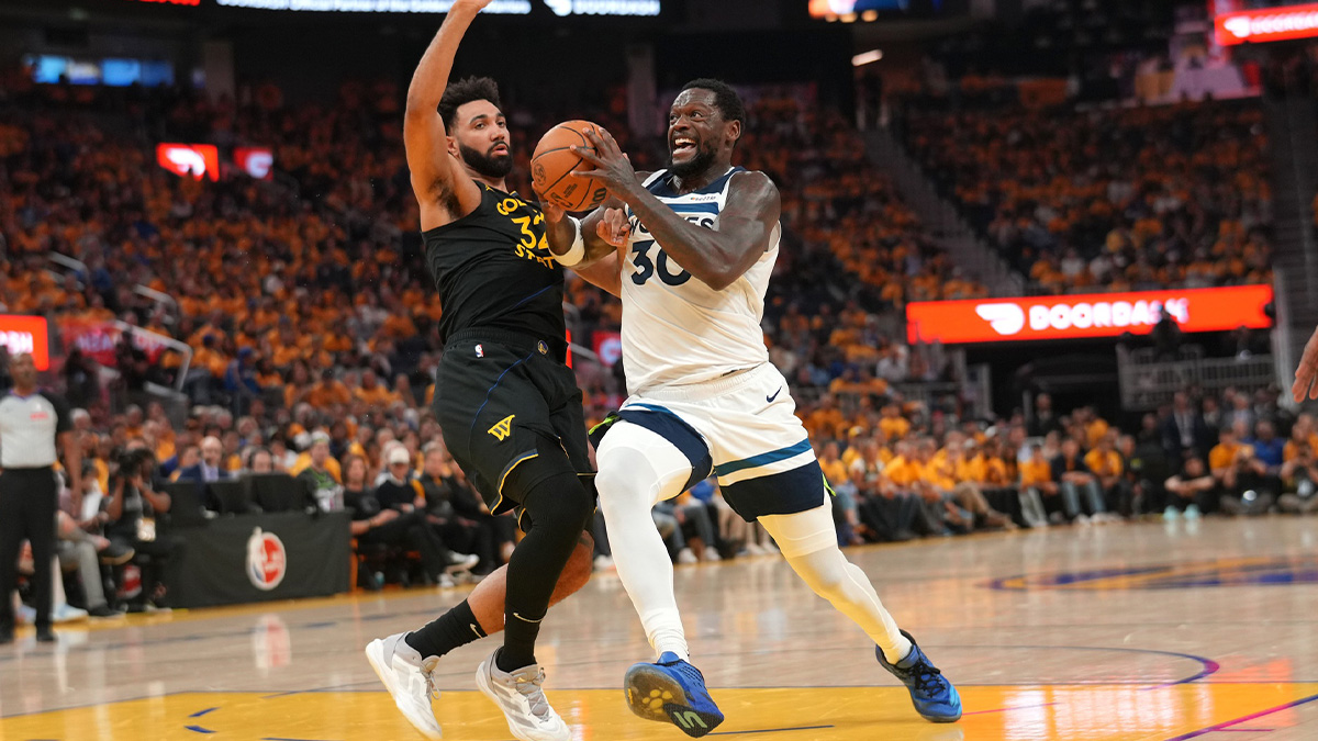 Minnesota Timberwolves forward Julius Randle (30) drives past Golden State Warriors forward Trayce Jackson-Davis (32) in the second quarter during game four of the second round for the 2025 NBA Playoffs at Chase Center.