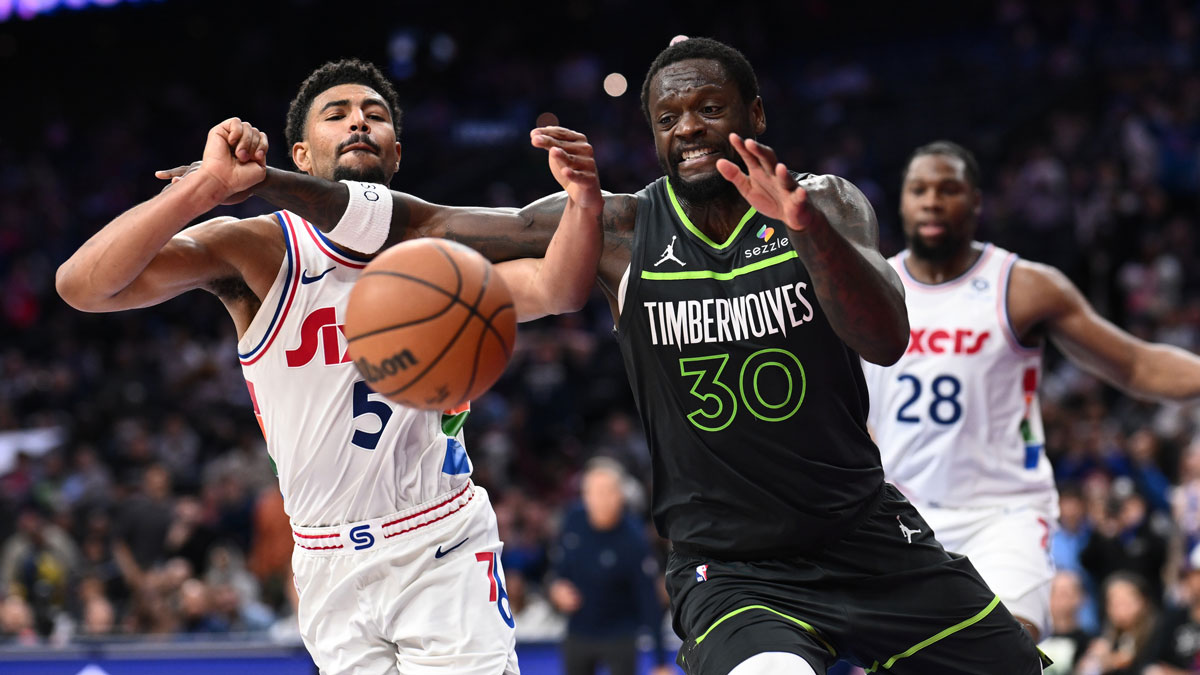 Minnesota Timberwolves forward Julius Randle (30) battles for the ball against Philadelphia 76ers guard Quentin Grimes (5) in the fourth quarter at Wells Fargo Center.