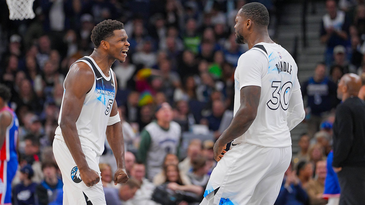 Minnesota Timberwolves guard Anthony Edwards (5) and forward Julius Randle (30) celebrate against the Sacramento Kings in the fourth quarter at Target Center.
