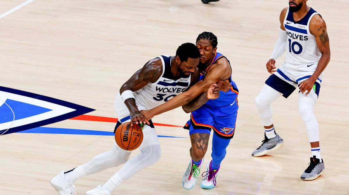 Minnesota Timberwolves forward Julius Randle (30) drives to the basket against Oklahoma City Thunder guard Luguentz Dort (5) during the third quarter in game five of the western conference finals for the 2025 NBA Playoffs at Paycom Center.
