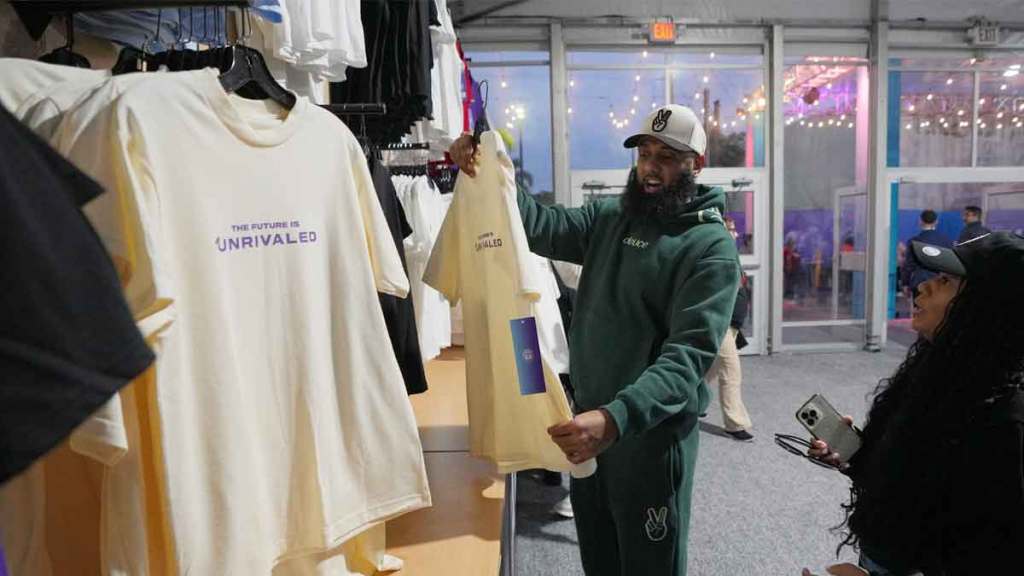 Justin Popop shops before the game between the Mist and the Lunar Owls of the Unrivaled women’s professional 3v3 basketball league.