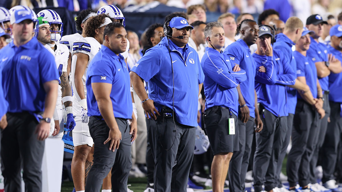 Brigham Young Cougars head coach Kalani Sitake (center) looks on during the fourth quarter of the game against the Kansas State Wildcats at LaVell Edwards Stadium.