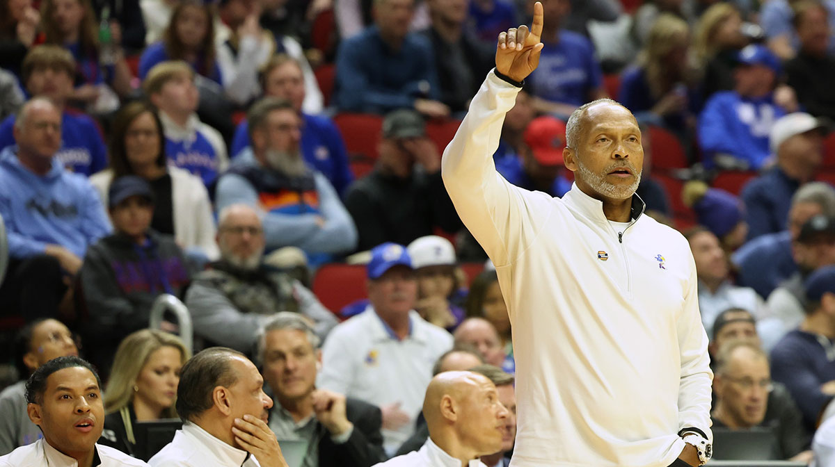 Kansas Jayhawks basketball acting head coach Norm Roberts signals to his players during the first half against the Arkansas Razorbacks at Wells Fargo Arena.