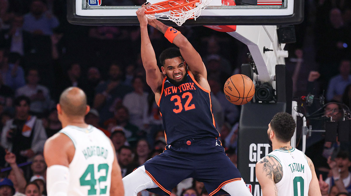 New York Knicks center Karl-Anthony Towns (32) dunks the ball in the second half during game four of the second round for the 2025 NBA Playoffs in front of Boston Celtics forward Jayson Tatum (0) at Madison Square Garden.