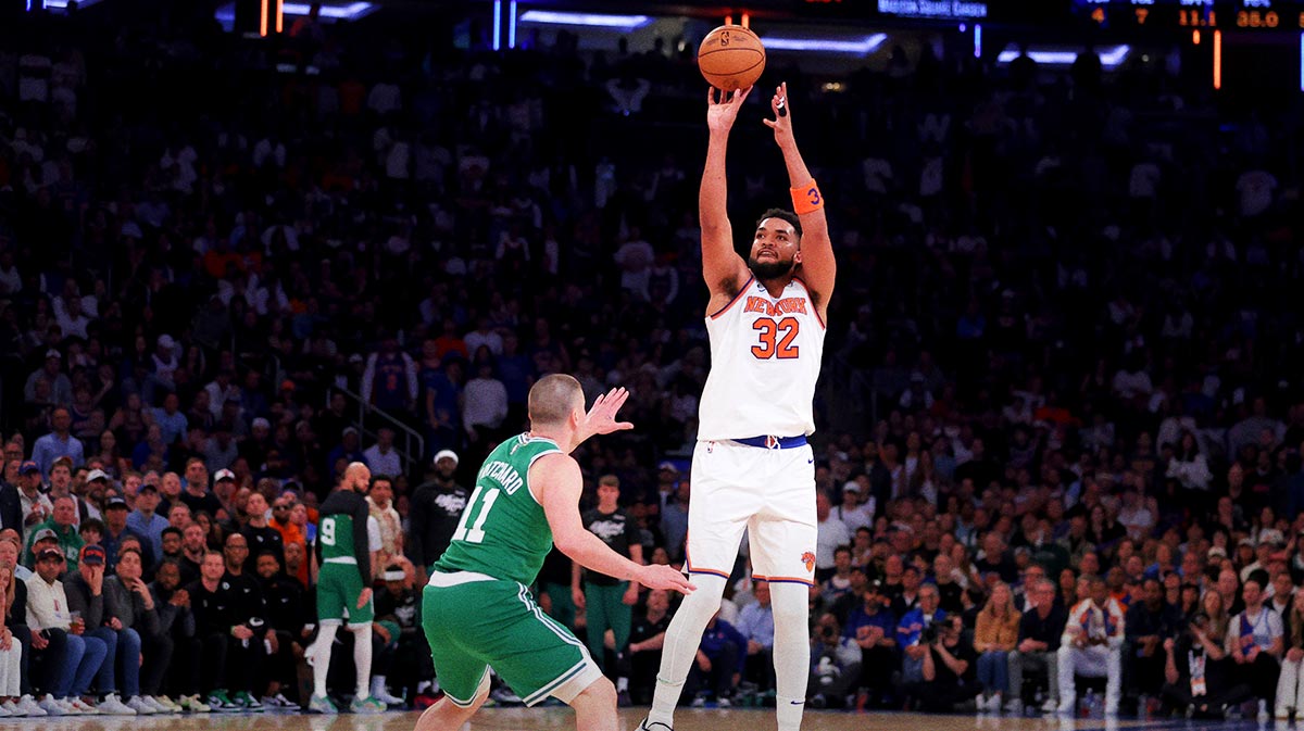 New York Knicks center Karl-Anthony Towns (32) shoots a three point shot against Boston Celtics guard Payton Pritchard (11) during the first quarter of game six in the second round of the 2025 NBA Playoffs at Madison Square Garden.
