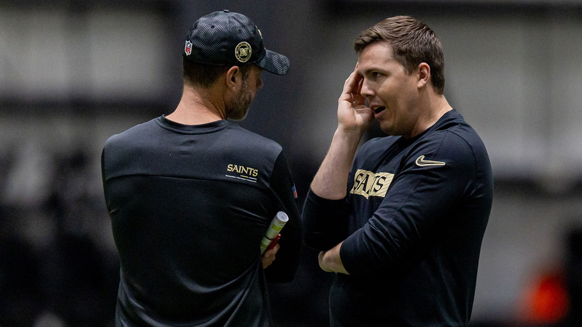 New Orleans Saints head coach Kellen Moore talks with defensive coordinator Brandon Staley during rookie minicamp at Ochsner Sports Performance Center.