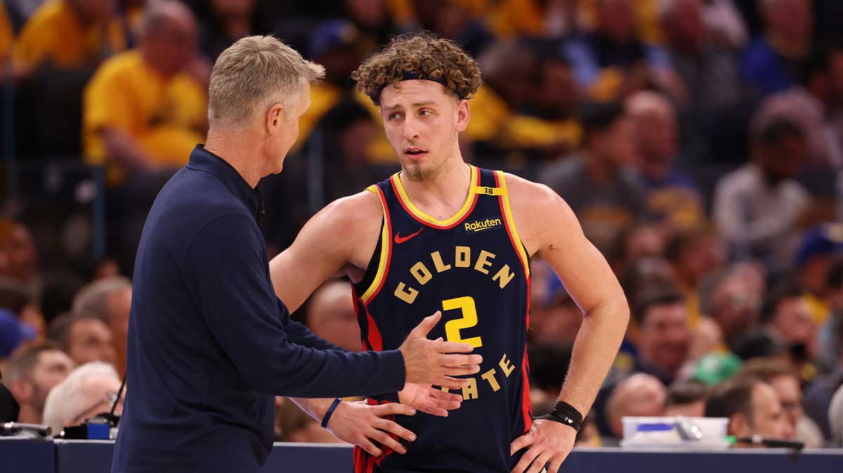 Golden State Warriors Golden State Warriors Steve Kerr speaks with guard Brandin Podziemski (2) during the third quarter of game four of the 2025 NBA Playoffs first round at Chase Center.