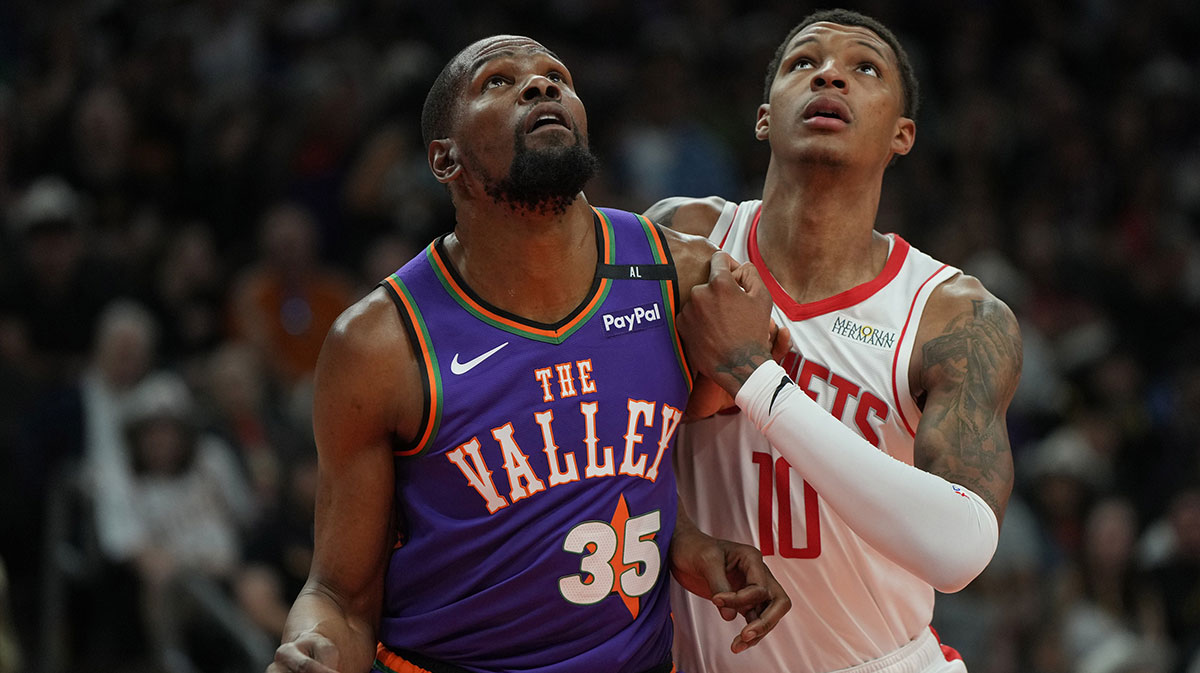 Phoenix Suns forward Kevin Durant (35) and Houston Rockets forward Jabari Smith Jr. (10) fight for position in the first half at Footprint Center.