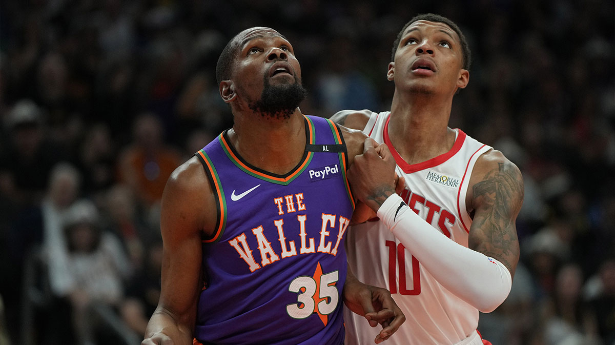 Phoenix Suns forward Kevin Durant (35) and Houston Rockets forward Jabari Smith Jr. (10) fight for position in the first half at Footprint Center.