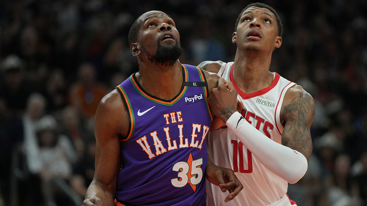 Phoenix Suns forward Kevin Durant (35) and Houston Rockets forward Jabari Smith Jr. (10) fight for position in the first half at Footprint Center.