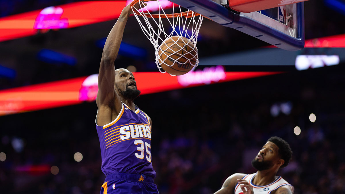 Phoenix Suns forward Kevin Durant (35) dunks against Philadelphia 76ers forward Paul George (8) during the third quarter at Wells Fargo Center.