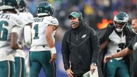 Dec 11, 2022; East Rutherford, New Jersey, USA; Philadelphia Eagles assistant coach Kevin Patullo celebrates with quarterback Jalen Hurts (1) after a touchdown during the second half against the New York Giants at MetLife Stadium.