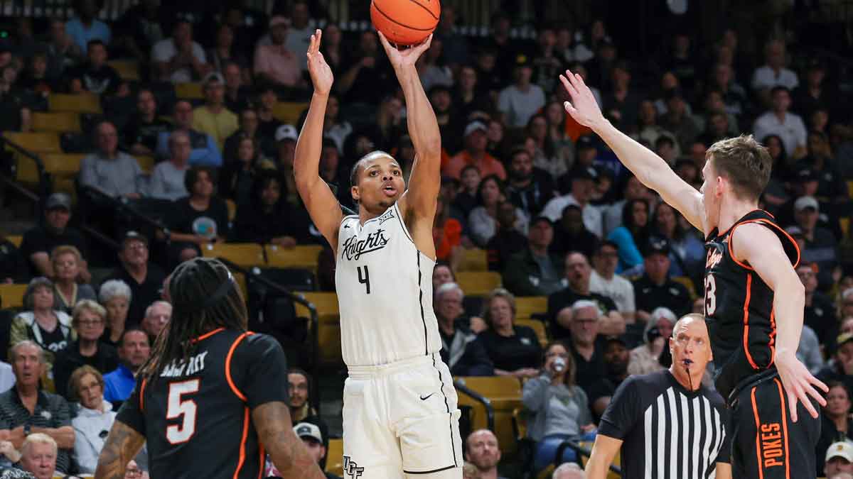 UCF Knights guard Keyshawn Hall (4) shoots during the second half against the Oklahoma State Cowboys at Addition Financial Arena.