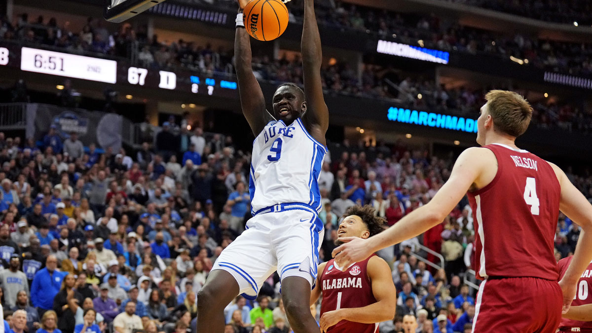 Duke Blue Devils center Khaman Maluach (9) dunks the ball against Alabama Crimson Tide forward Grant Nelson (4) during the second half in the East Regional final of the 2025 NCAA tournament at Prudential Center.