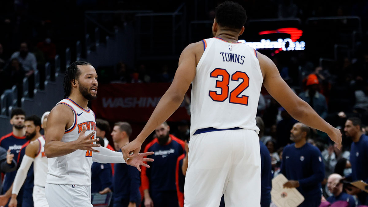 New York Knicks guard Jalen Brunson (11) celebrates with Knicks center Karl-Anthony Towns (32) against the Washington Wizards in the fourth quarter at Capital One Arena.