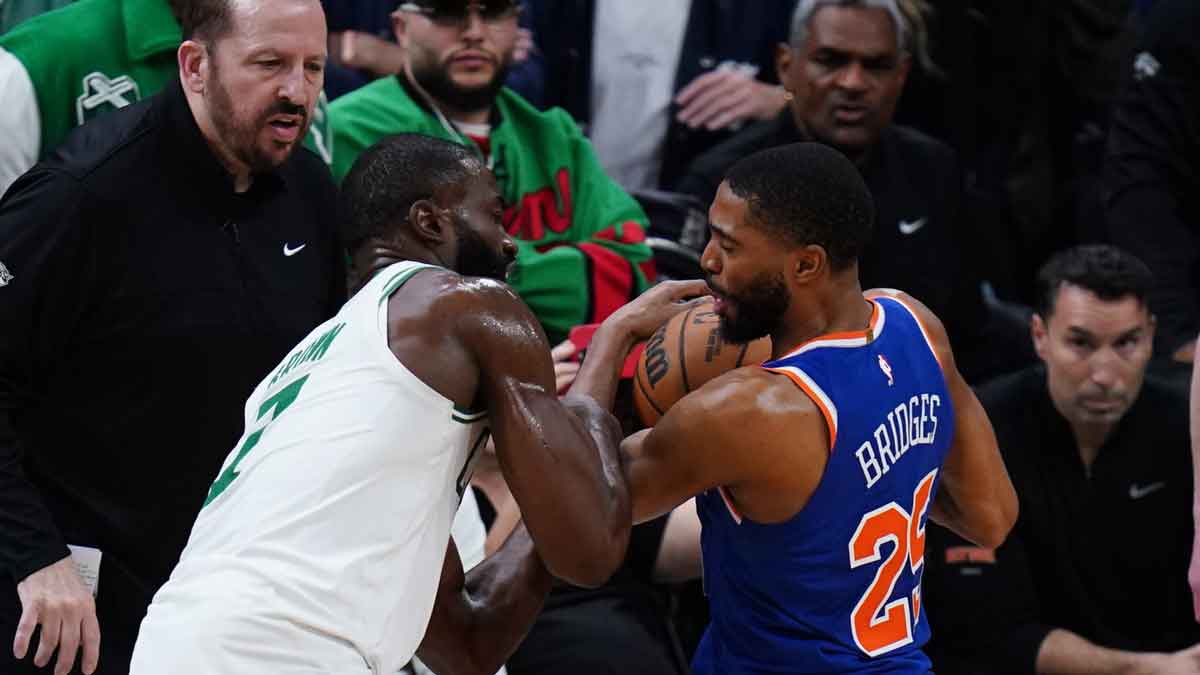 New York Knicks forward Mikal Bridges (25) strips the ball from Boston Celtics guard Jaylen Brown (7) winning the game in overtime during game one of the second round for the 2025 NBA Playoffs at TD Garden.