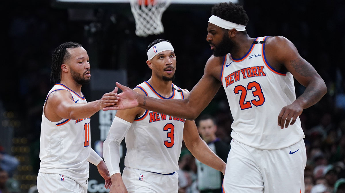 New York Knicks guard Jalen Brunson (11) and center Mitchell Robinson (23) react after a play against the Boston Celtics in the second half during game two of the second round for the 2025 NBA Playoffs at TD Garden.