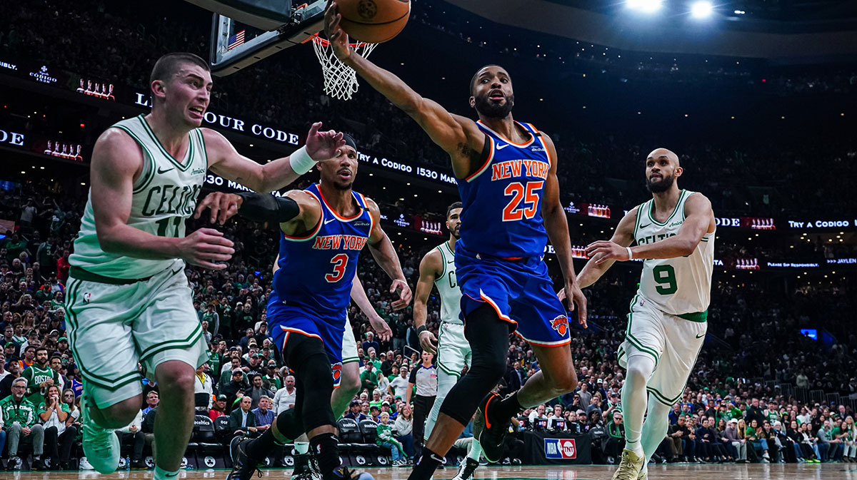 May 5, 2025; Boston, Massachusetts, USA; New York Knicks forward Mikal Bridges (25) works for the ball against Boston Celtics guard Payton Pritchard (11) in the third quarter during game one of the second round for the 2025 NBA Playoffs at TD Garden. Mandatory Credit: David Butler II-Imagn Images