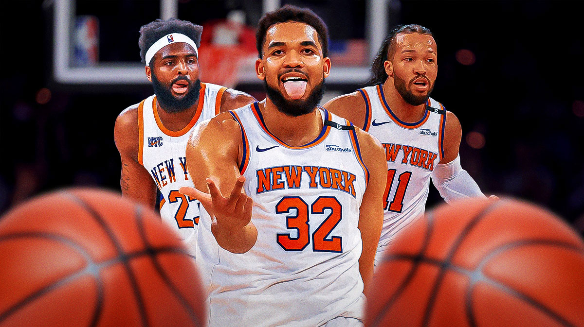 Karl-Anthony Towns celebrating with Mitchell Robinson celebrating and Jalen Brunson doing his three point celebration on either side of him.