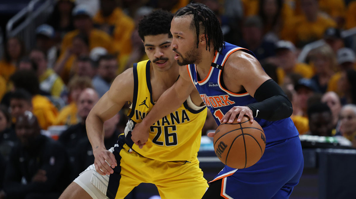 New York Knicks guard Jalen Brunson (11) dribbles downcourt past Indiana Pacers guard Ben Sheppard (26) during the third quarter of game three of the eastern conference finals for the 2025 NBA Playoffs at Gainbridge Fieldhouse.