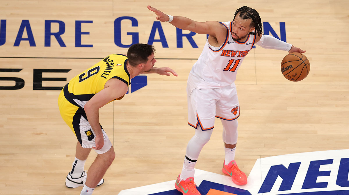 New York Knicks guard Jalen Brunson (11) controls the ball against Indiana Pacers guard T.J. McConnell (9) in the fourth quarter during game five of the eastern conference finals for the 2025 NBA Playoffs at Madison Square Garden.