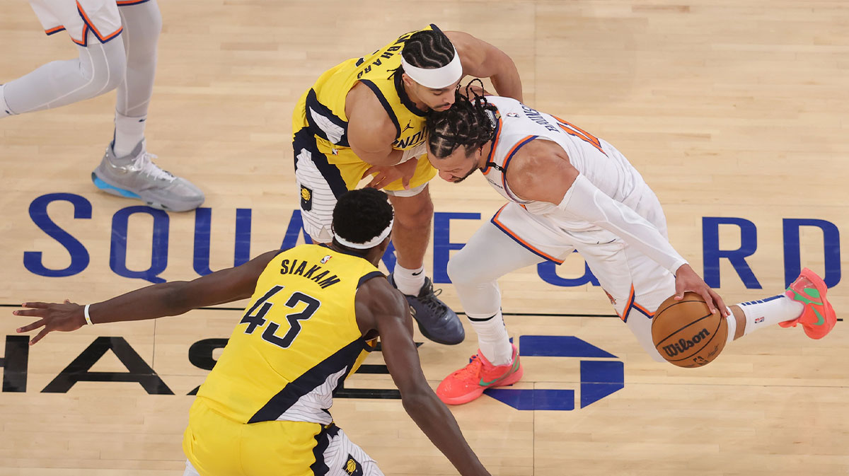 New York Knicks guard Jalen Brunson (11) controls the ball against Indiana Pacers guard Andrew Nembhard (2) and forward Pascal Siakam (43) in the third quarter during game five of the eastern conference finals for the 2025 NBA Playoffs at Madison Square Garden.