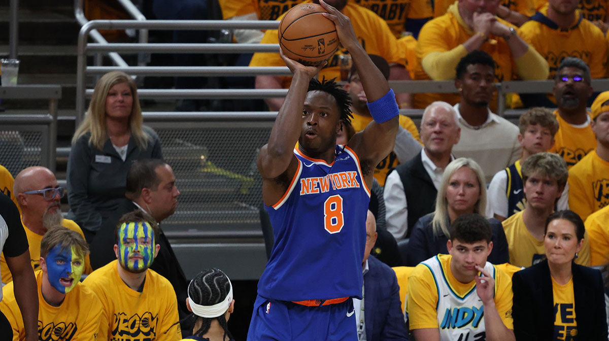 New York Knicks forward OG Anunoby (8) shoots a three point basket over Indiana Pacers guard Andrew Nembhard (2) during the first quarter of game three of the eastern conference finals for the 2025 NBA Playoffs at Gainbridge Fieldhouse.