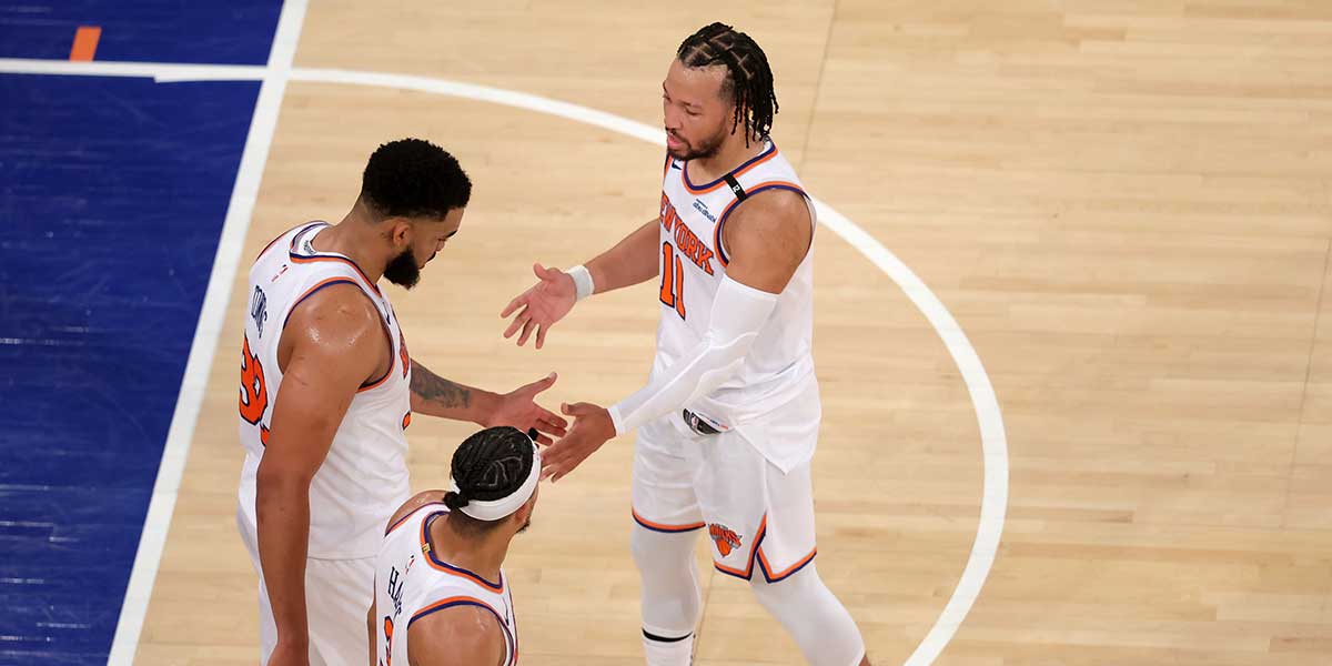New York Knicks guard Jalen Brunson (11) and center Karl-Anthony Towns (32) and guard Josh Hart (3) react in the fourth quarter against the Indiana Pacers during game five of the eastern conference finals for the 2025 NBA Playoffs at Madison Square Garden. 