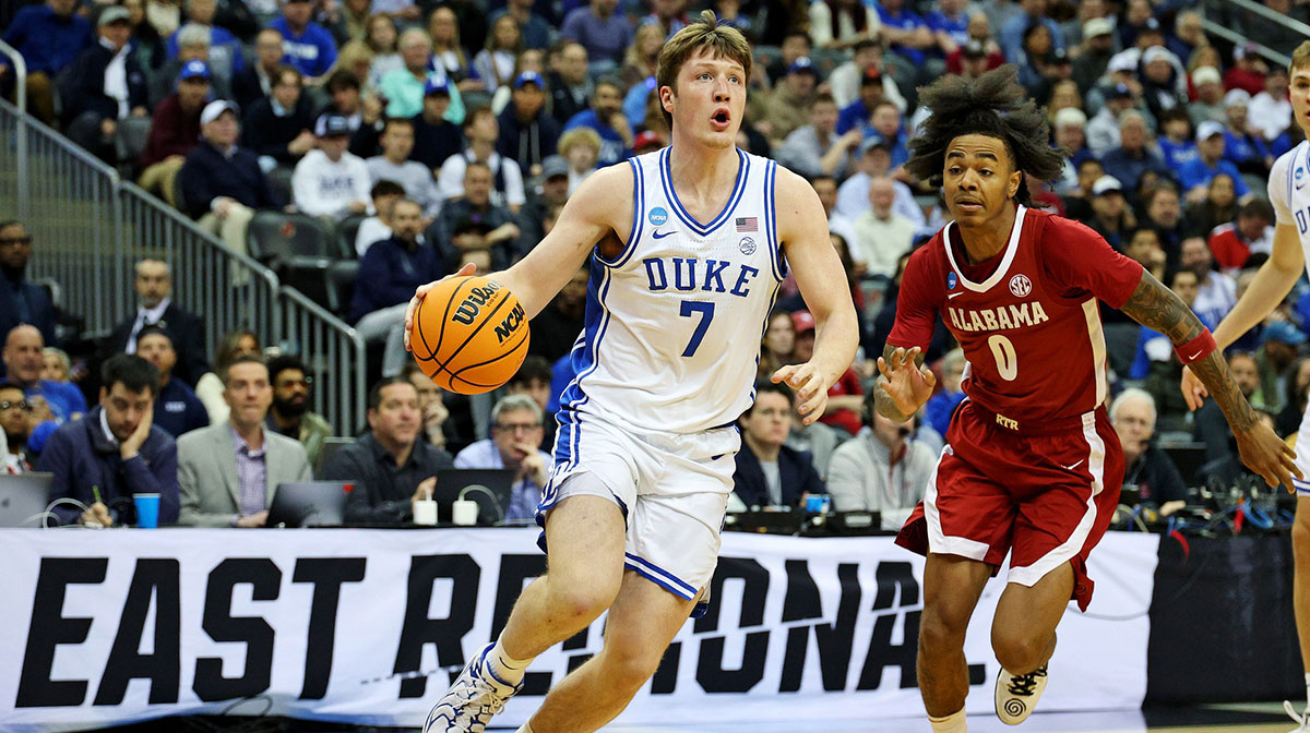Duke Blue Devils guard Kon Knueppel (7) drives to the basket against Alabama Crimson Tide guard Labaron Philon (0) during the first half in the East Regional final of the 2025 NCAA tournament at Prudential Center.