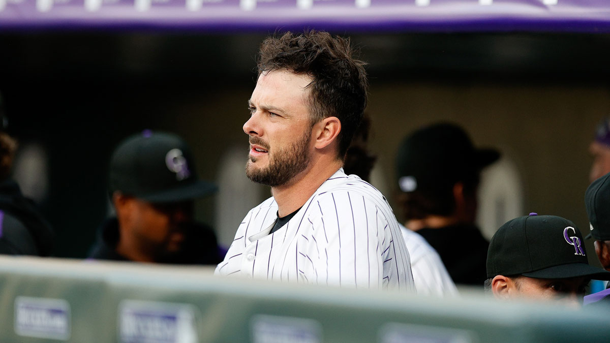 Colorado Rockies designated hitter Kris Bryant (23) looks on from the dugout before the game against the Milwaukee Brewers at Coors Field.