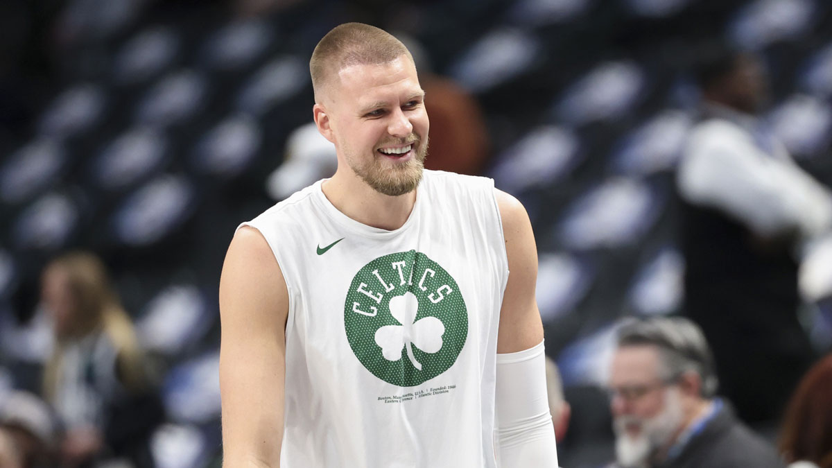 Boston Celtics center Kristaps Porzingis (8) laughs before the game against the Dallas Mavericks at American Airlines Center.