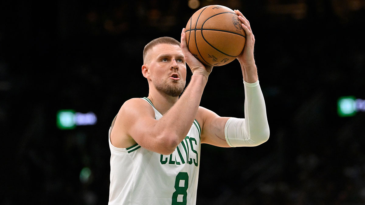 Boston Celtics center Kristaps Porzingis (8) shoots a free throw during the first half against the Charlotte Hornets at TD Garden.