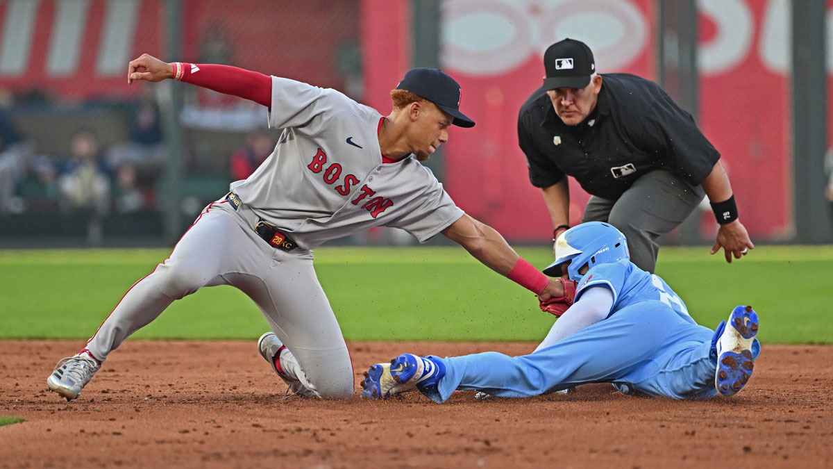 Boston Red Sox second baseman Kristian Campbell tags out Kansas City Royals left fielder Mark Canha attempting to steal second base in the third inning.