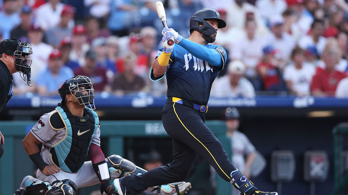 Philadelphia Phillies outfielder Kyle Schwarber (12) hits an RBI double against the Arizona Diamondbacks during the first inning at Citizens Bank Park.
