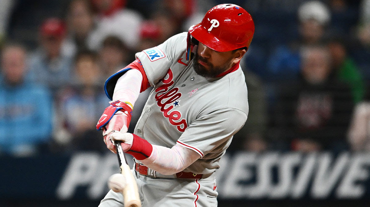 Philadelphia Phillies designated hitter Kyle Schwarber (12) hits a home run during the eighth inning against the Cleveland Guardians.