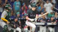 May 3, 2025; Miami, Florida, USA; Miami Marlins right fielder Kyle Stowers (28) hits a walk-off grand slam against the Oakland Athletics in the ninth inning at loanDepot Park.