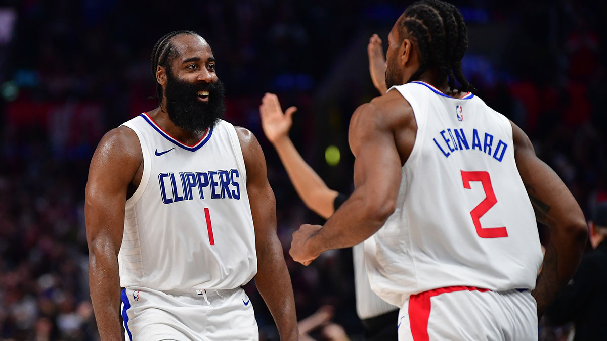 Los Angeles Clippers guard James Harden (1) reacts after forward Kawhi Leonard (2) scores three point basket against the Brooklyn Nets during the second half at Crypto.com Arena.