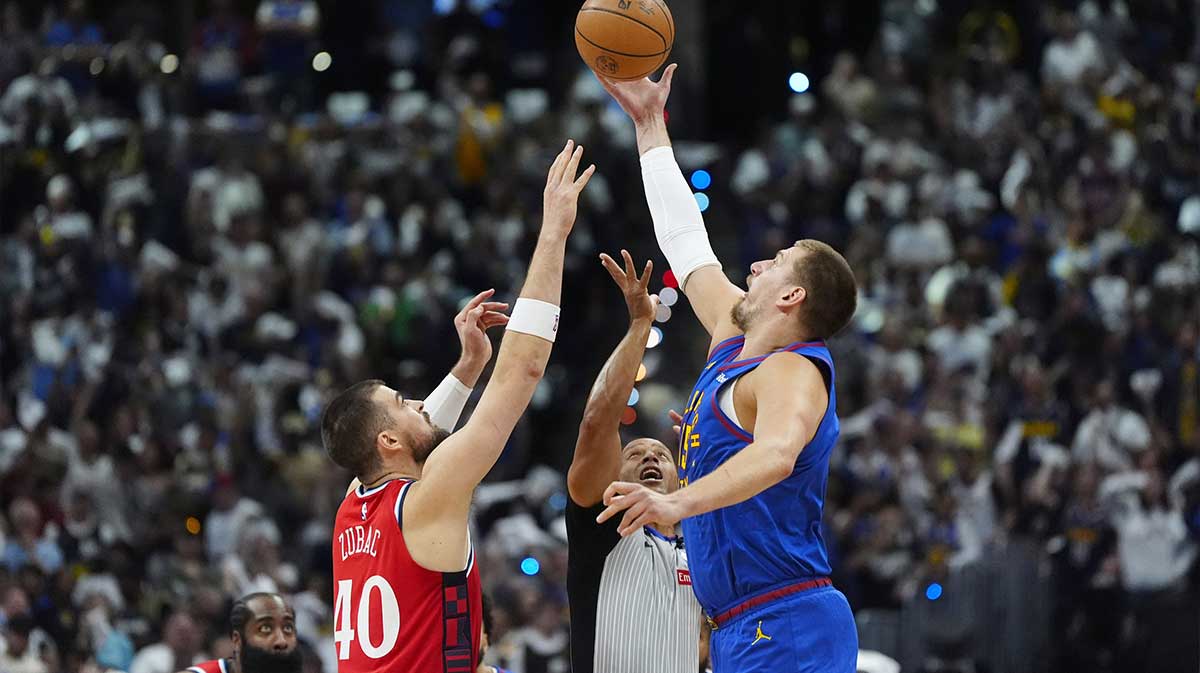 LA Clippers center Ivica Zubac (40) and Denver Nuggets center Nikola Jokic (15) reach for the tip off in the first quarter during game seven of first round for the 2025 NBA Playoffs at Ball Arena.