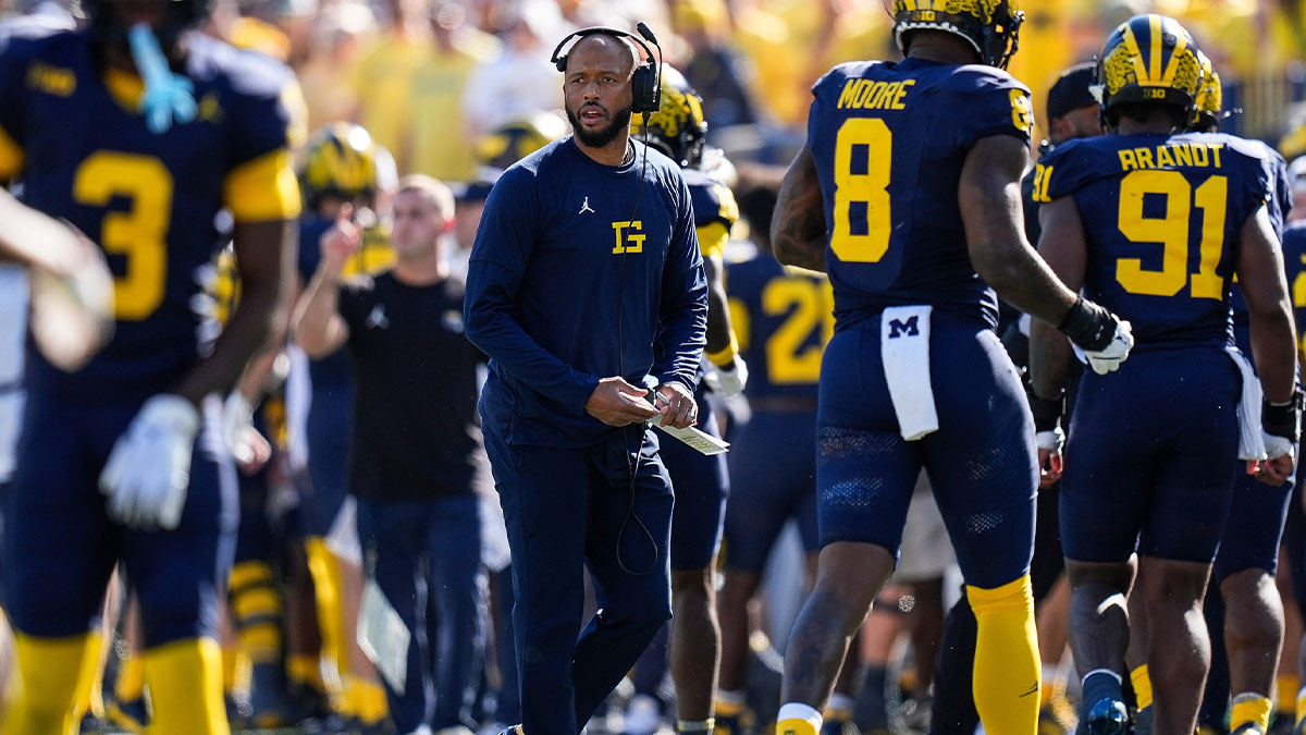 Michigan defensive back coach LaMar Morgan looks on after a play against USC during the first half at Michigan Stadium